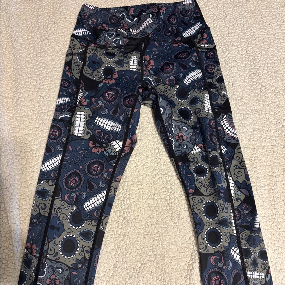 Constantly Varied Gear CVG Leggings with Floral and Skull Pattern.